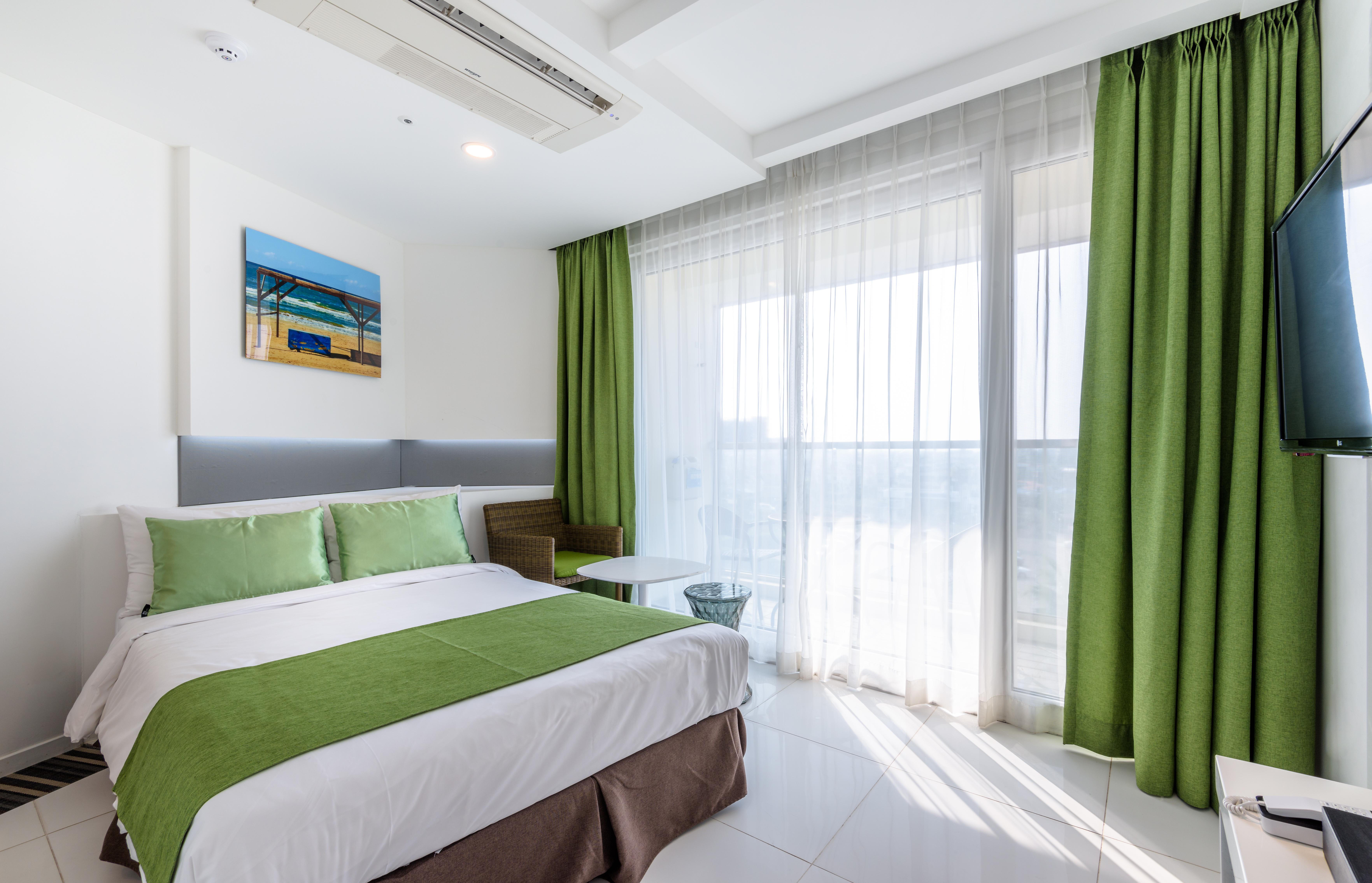 Aimi Jeju Beach Hotel Bagian luar foto