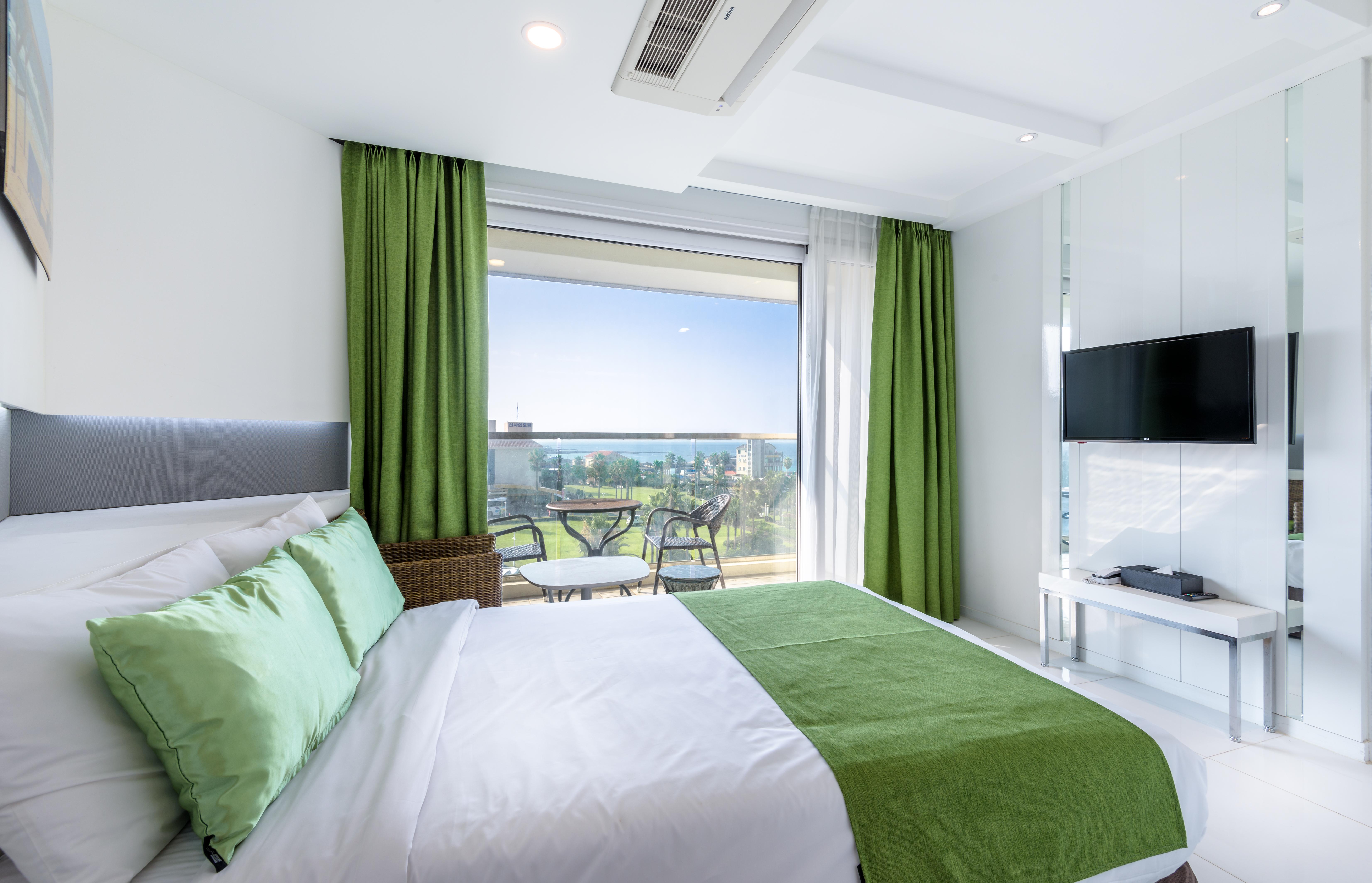 Aimi Jeju Beach Hotel Bagian luar foto