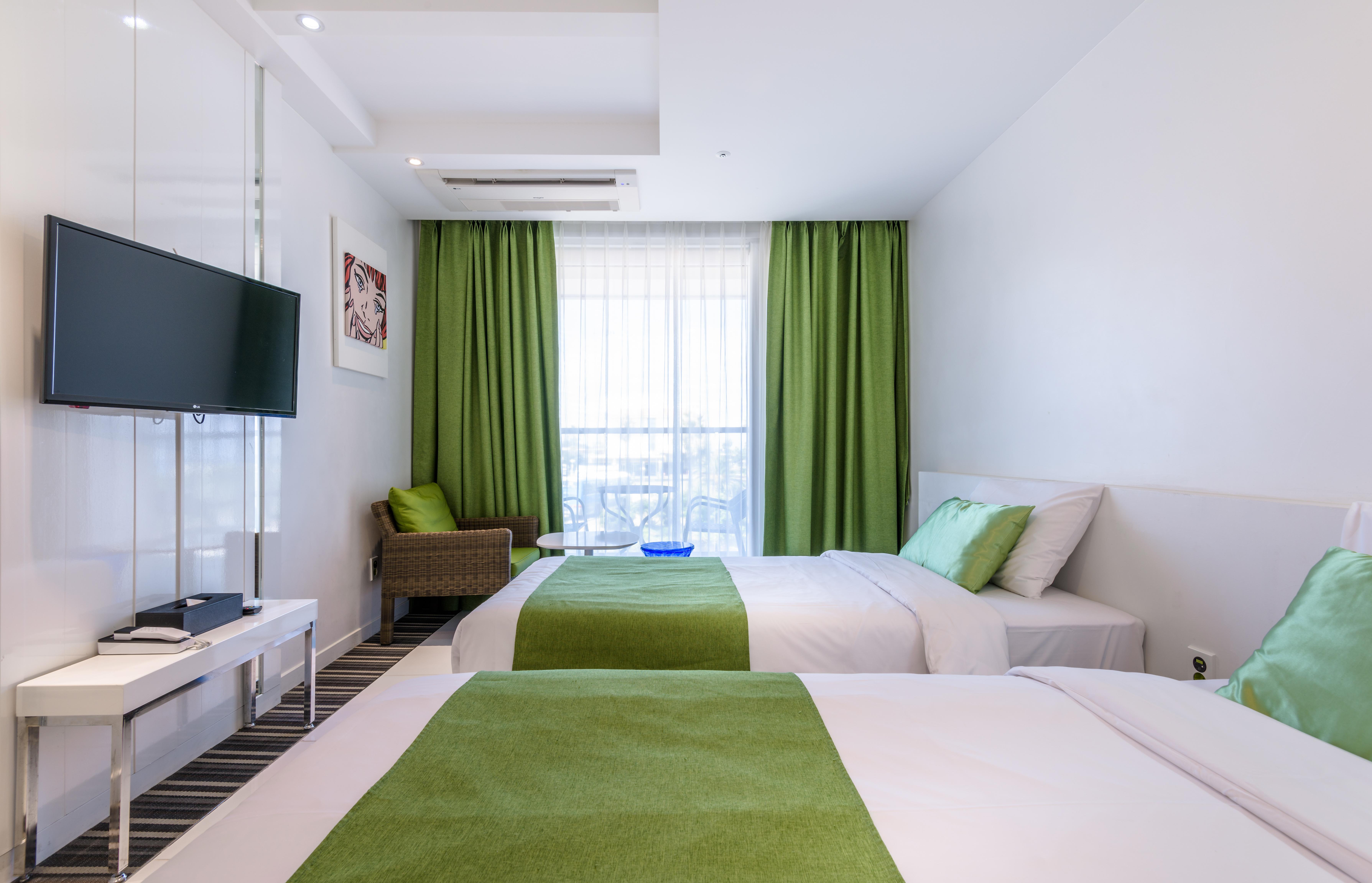 Aimi Jeju Beach Hotel Bagian luar foto